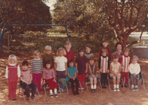 Me in preschool I am the forth one from the left in the striped shirt with an insect in my pocket no doubt.